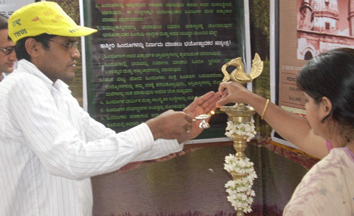 Shri. Chandra Moger, Sanatan Sanstha inaugurated the exhibition by lighting the lamp.