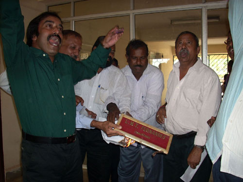 Angry Shivsainiks damaging the name plate of Mr. L.M.T. Fernandes