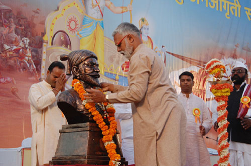 Offering garland to Chatrapati Shivaji Maharaj's statue.