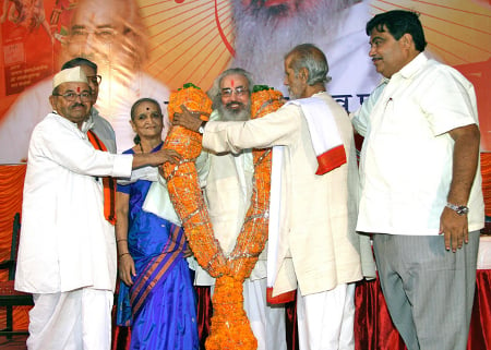 Shri. Vikramrao Savarkar being felicitated