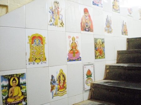 Tiles with Deities' pictures on walls of building of Bank