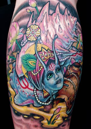 A colorful tree tattoo denoting the symbol 'Om' of Hindu mythology.
