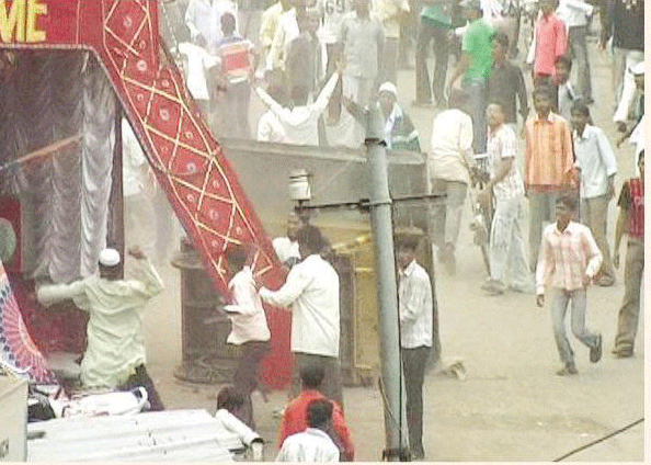The Muslims attacking and bringing down the Ganesh pooja pandal at Miraj town.