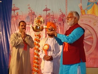 Mr. Abhay Vartak, H. B. P. Sinnarkar Maharaj and Mr. Vinay Panwalkar while lighting the Holy Lamp