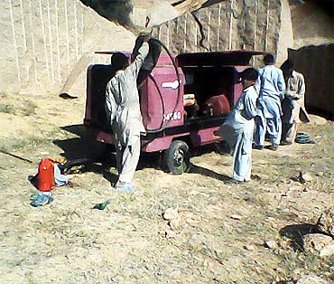 Contractors' machines at the base of the hill