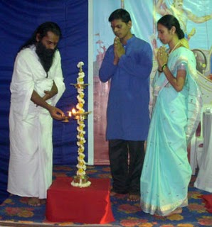 H. H. Baba Mahahansaji while lighting the lamp, Mr. Shashank Deshmukh and Adv. Ms. Rucha Bhise