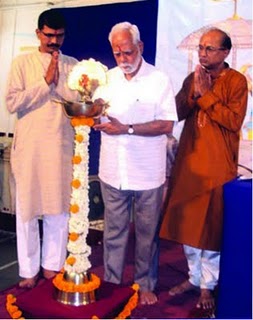 Mr. Rajendraprasad Bhogale,  Arvind Vitthal Kulkarni and Mr. Ajay Sambhus while lighting the Holy La