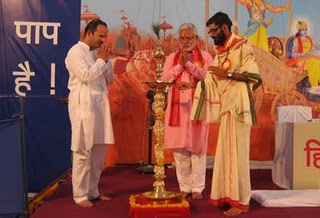Mr. Abhay Vartak, Mr. Vinay Panwalkar, H. B. P. Yogesh Maharaj Salegaonkar lighting Holy Lamp