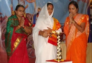 Mrs. Sunita Jamnare, H. B. P. Kamaltai Tank and Miss Sharvari Padhye lighting the Holy Lamp