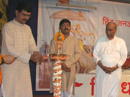 From Left : Mr. Rajendraprasad Bhogale, Dr. Uday Dhuri and Mr. Durgesh Parulkar while lighting the H