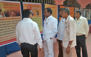 Mr. Prabhakar  Chaudhary, Mr. Dinesh Achalkar and others watching the exhibition