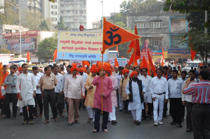 A devout Hindu activist carrying 'Dharmadhvaj'