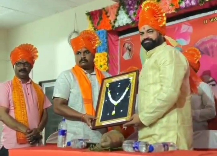 Mr Nitin Chougulai (right) felicitating Mr Nitin Kakade (second from left), Mr Nilkanth Mane is seen alongside (left)