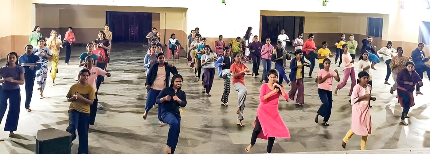 Participating young women performing karate techniques during the training camp