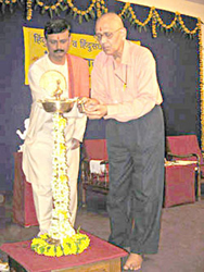Shri. Milind Gadgil & Dr. Durgesh Samant lighting the inaugural lamp