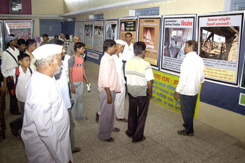 People visiting the photo-exhibition in Dhule