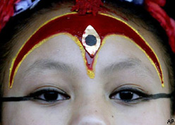 Kumari Devi appears during the <br />Bhotojatra festival, Kathmandu” title=”Kumari Devi appears during the <br />Bhotojatra festival, Kathmandu” /><br />
<br />Kumari Devi appears during the <br />Bhotojatra festival, Kathmandu
</div>
<p> Kathamandu (Nepal): </strong>A 10-year-old Nepali girl worshipped as a living goddess, or Kumari, has lost her "divine" status for defying tradition and visiting the United States.</p>
<p>Sajani Shakya was installed at the age of two as the Kumari of the ancient town of Bhaktapur, near the capital Kathmandu, where Hindus and Buddhists alike revere her.</p>
<p>But a recent trip to the United States to promote a British-made documentary exploring Nepal’s traditions and contemporary political turmoil has upset local religious leaders. "It is wrong and against the tradition for her to go on a foreign tour without any permission," said Jai Prasad Regmi, chief of a trust that manages the affairs of Bhaktapur’s Kumari tradition.</p>
<p>"This is impure in our tradition. We will search for a new Kumari and install her as the living goddess," Regmi said. Bhaktapur’s is one of several Kumaris in the Kathmandu valley. The most important lives in a 15th century temple in Kathmandu&rsquo;s ancient Durbar Square.</p>
<p>Living goddesses are chosen from the Buddhist Shakya family after a tough selection process. They are required to stay in temples blessing devotees until reaching puberty, after which they rejoin their family and lead a normal life. "We are discussing whether or not to pay Sajani monthly pension. We are positive on this," Regmi said. While other living goddesses get a monthly pension of $17 each after retirement, Kathmandu’s gets about $50 a month.</p>
<p>Nepal’s Supreme Court last year ordered the government to submit a detailed report on whether the Kumari tradition violated the children’s human rights. Officials say the study is underway.</p>
<p><strong>Source: </strong><a onclick=