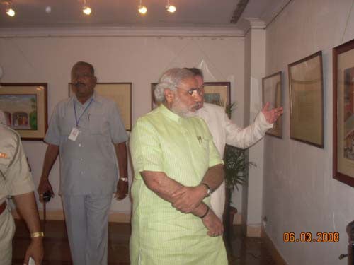 Shri. Narendra Modi watching the exhibition