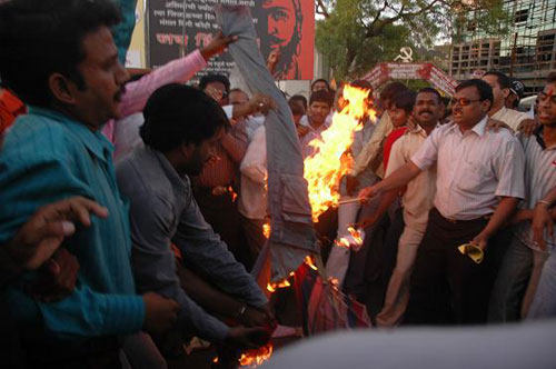 RSS activists burning CPM flag