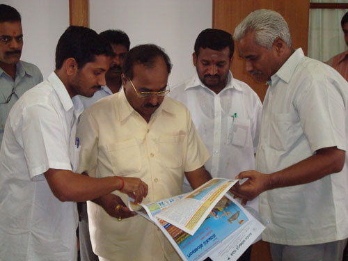 Seekers of Sanatan Sanstha explaining about Sanatan Panchang to Shri. Shetty, Endowment Minister