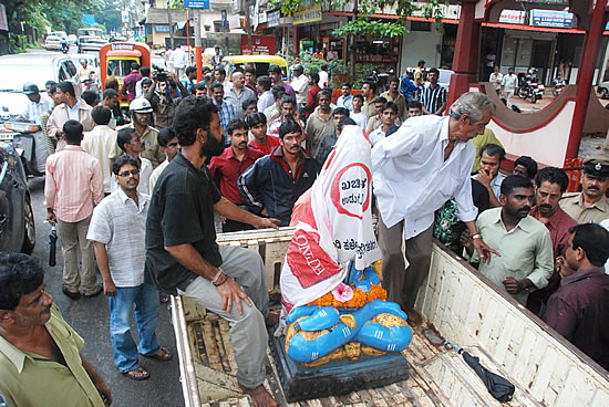 Damaged idol of Lord Shiva being taken away from Temple