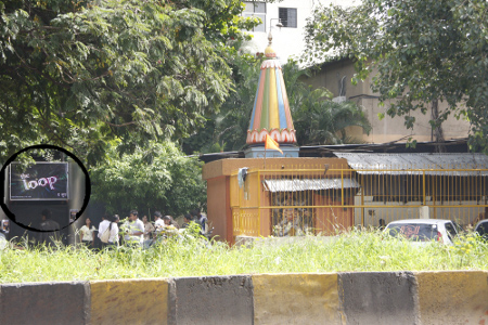 Circled: Board of 'The Loop' pub near Sree Kalubai Temple