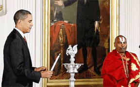 President Obama lighting a Kuthuvilakku