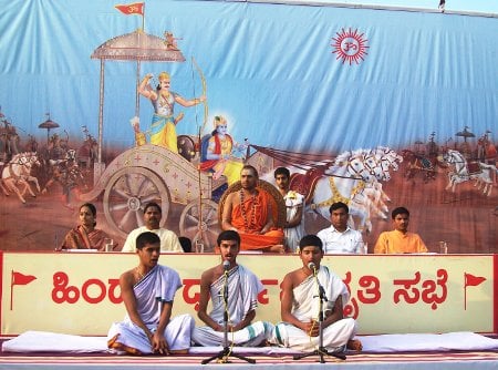 Vedmurtis reciting Ved mantras and Speakers of Dharmasabha behind Vedmurtis