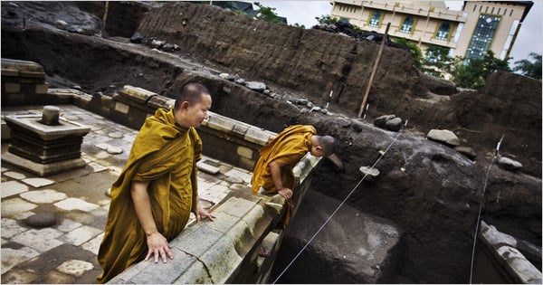 Buddhist monks inspected a 9th century Hindu temple recently unearthed in Indonesia