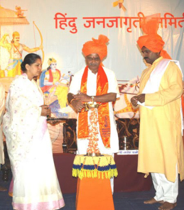 Inauguration of  'DharmaSabha' by lighting an oil lamp