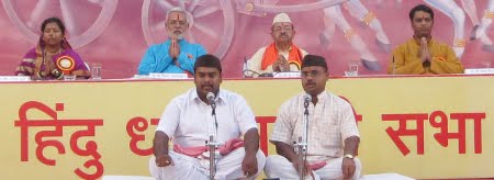 Vedmurtis reciting ved-mantras, speakers of the Sabha are sitting behind them