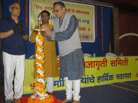 From left Mr. Avinash Kolhatkar, Mr. Ramesh Shinde and Mr. Dadasaheb Bendre lighting the Holy Lamp
