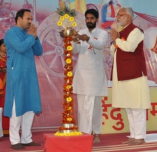 Mr. Abhay Vartak, H. B. P. Jalakekar Maharaj and Mr. Vinay Panwalkar while lighting the Holy Lamp