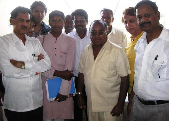 Mr. Setty with Mr. Chandra Moger to his right and Mr. Nagraj Naidu to his left and others