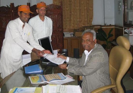 Mr. Chandra handing over the memorandum to the Commissioner Mr. Siddaiah