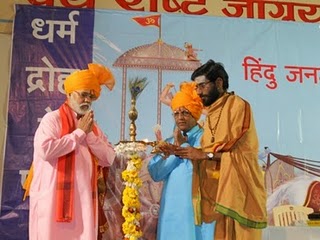 Mr. Vinay Panwalkar, Mr. Nandkumar Jadhav and H. B. P. Salegaonkar Maharaj lighting the Holy Lamp