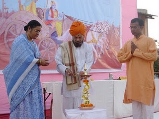 Mrs.Meenakshi Kolhe, H.B.P.Shrikrushna Maharaj Sinnarkar, Mr.Dnyaneshwar Bhagure lighting Holy Lamp
