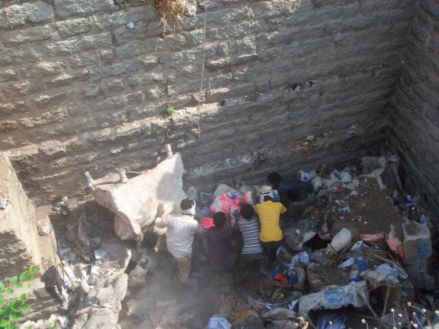 Labourers removing Sri Ganesh idols from the man-made pond - 1