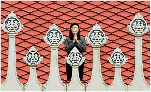 Prime Minister Yingluck Shinawatra pays respects and ask for blessings from a sacred shrine