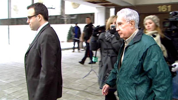 Raymond Lahey walks quickly past reporters after sentencing at an Ottawa courthouse. (CBC)