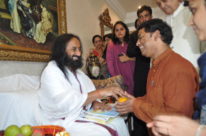 Pu. Sri Sri Ravishankar (Left) blessing Mr. Ramesh Shinde of HJS (Right)
