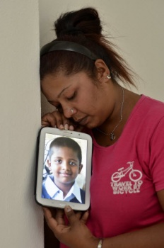 Deepa with a photo of her son Mithran Deepa with a photo of her son Mithran