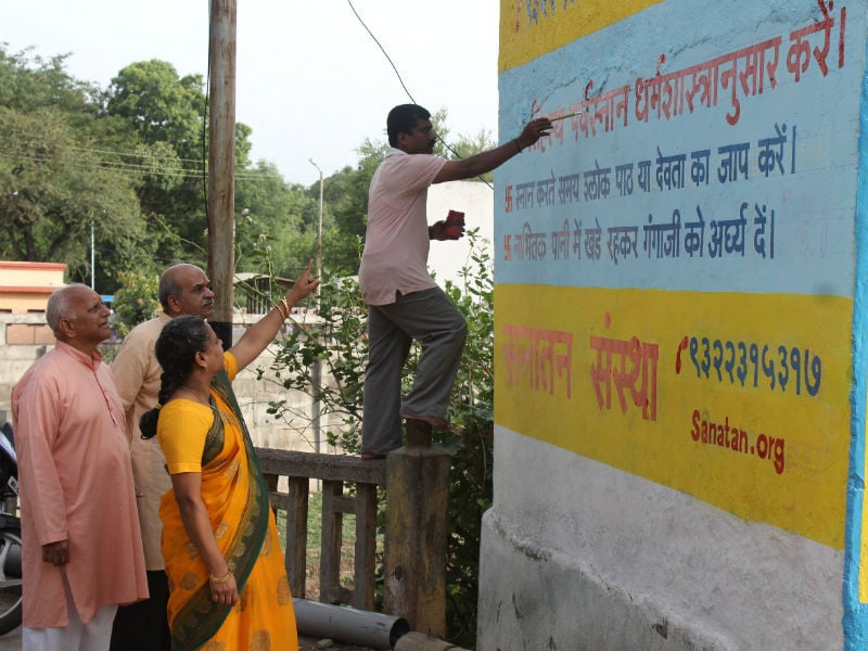 Sanatan's Saints guiding seekers who are painting walls