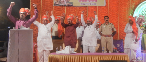 Raising slogans from stage are – from left – Shri. Sumit Sagavekar and other dignitaries