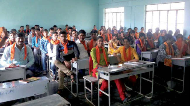 Students of Sri Kumareshwar Arts and Commerce College in Hangal sport safforn scarves (Photo: DC)