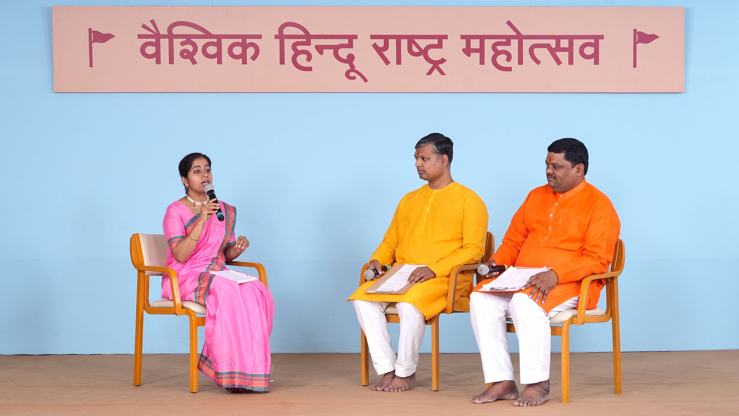 Ms Kritika Khatri (Spokesperson, Sanatan Sanstha, Delhi) compering during the deliberations on the subject of Mandir Sanghatan, while Mr Prashant Juvekar (Coordinator, Hindu Janajagruti Samiti, Jalgaon, Maharashtra) and Mr Sunil Ghanwat (Rajya Sangathak, Hindu Janajagruti Samiti, Maharashtra and Chhattisgarh) elucidate the efforts made and success achieved during the move to unite temples