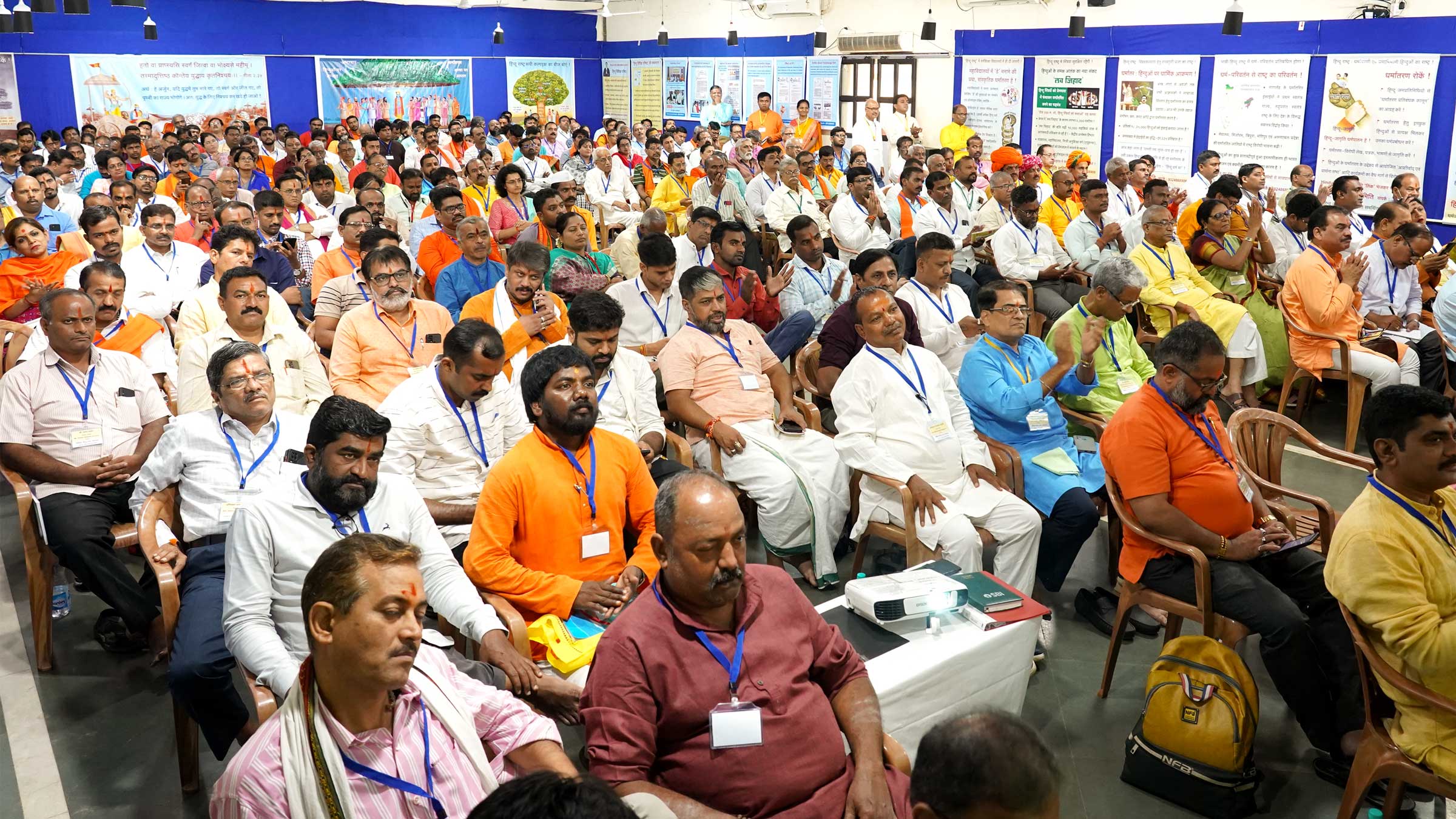 Devout Hindus listening to the speeches of dignitaries in rapt attention