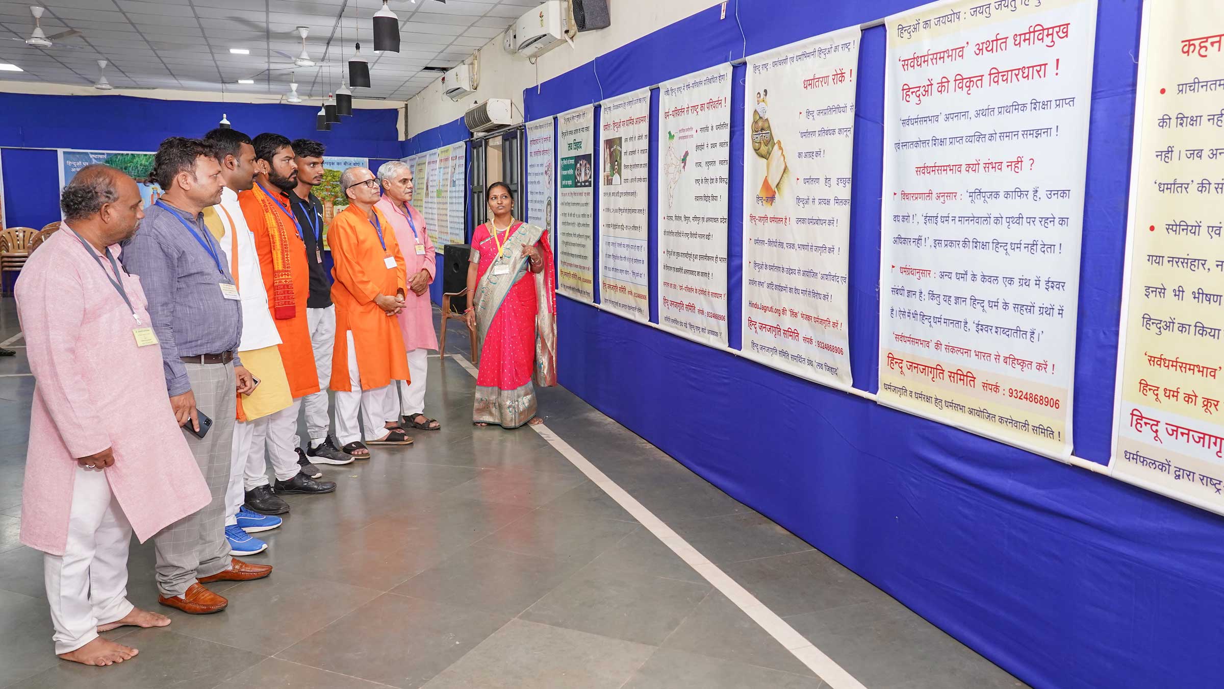 Volunteers of Hindu Janajagruti Samiti showing the Devout Hindus posters in an exhibition that brings about awakening on Dharma