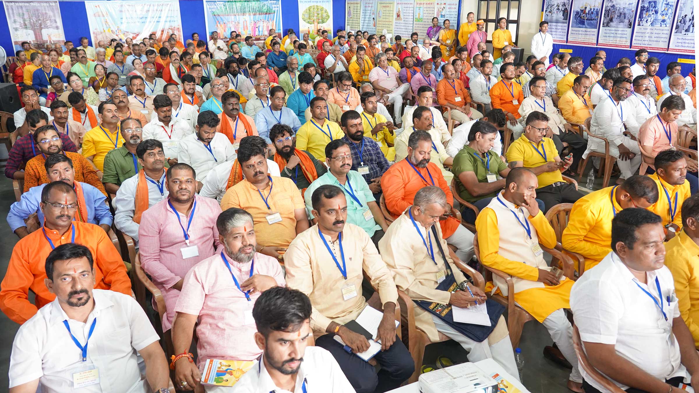 Devout Hindus listening intently to the scholarly speeches