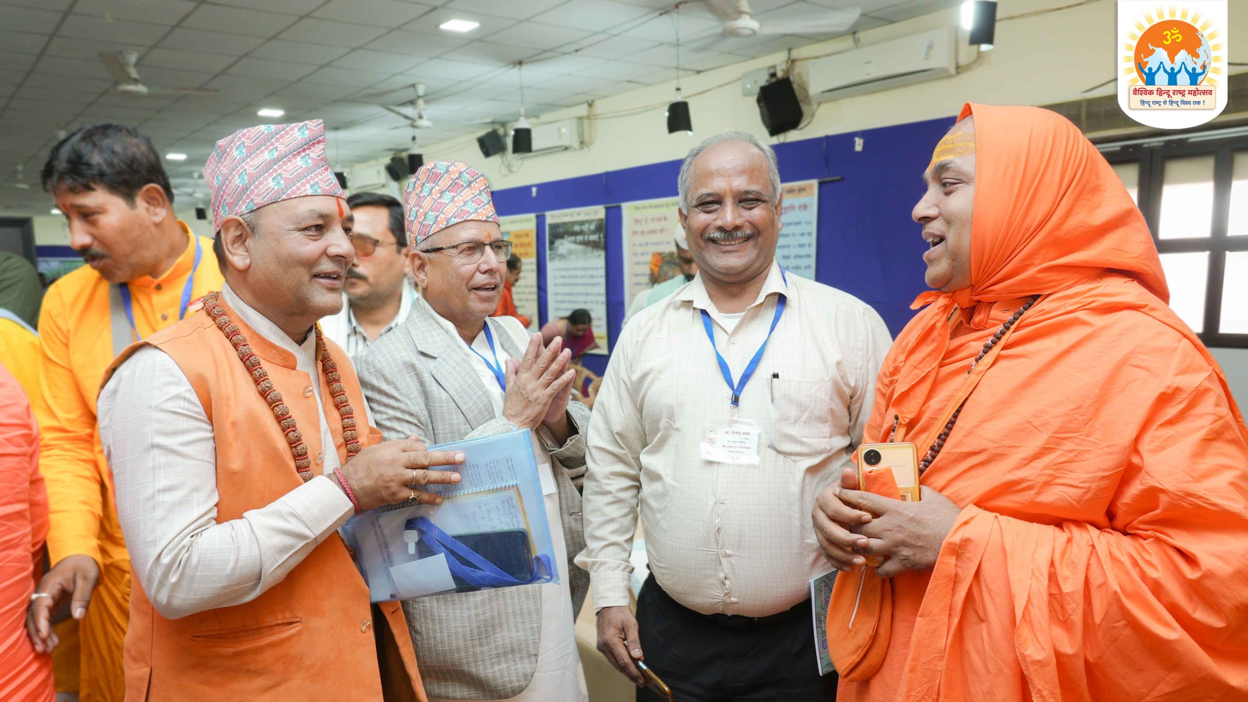 Devout Hindu participants of the Vaishvik Hindu Rashtra Mahotsav having a friendly chat